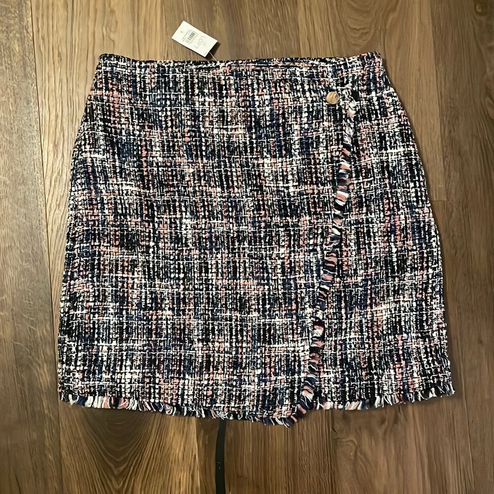Tweed skirt with asymmetrical detail and gold button